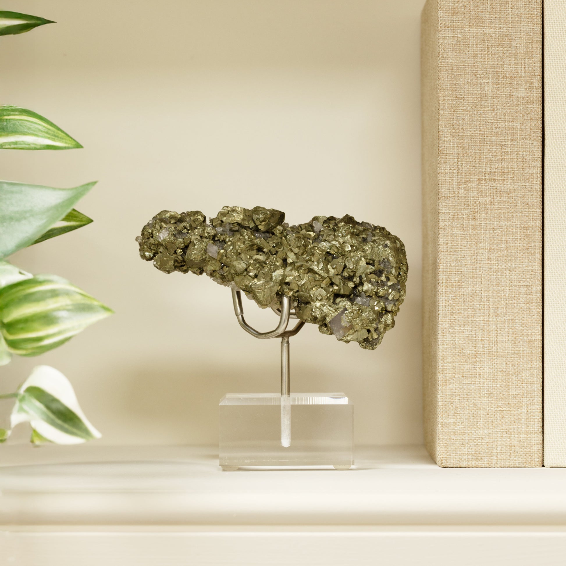 Genuine Pyrite specimen on a metal stand